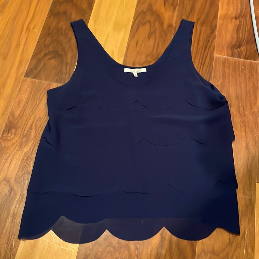 Navy tank with layered ruffles in front